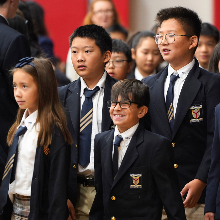 Group of students posing in full school uniform